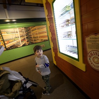 Young Boy Exploring Train Museum Display