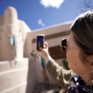 Tourist Photographing Adobe Architecture in Santa Fe