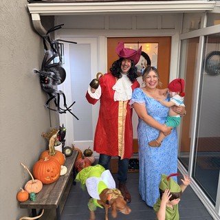 Family Peter Pan Halloween Costume at Decorated Porch