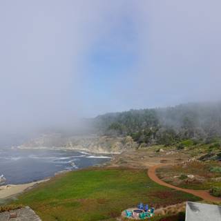 Spectacular Scenery of the Foggy Ocean from a Promontory