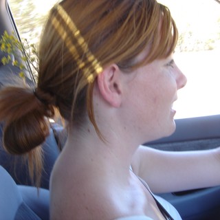 Redhead Woman Driving on a Sunny Afternoon