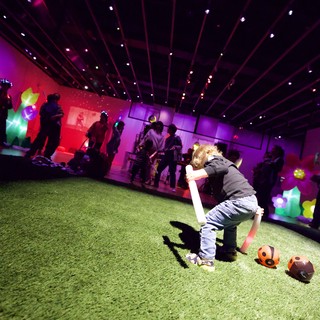 Child Playing at Baby Rave Event with Neon Lights