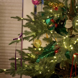 Colorful Ornaments on Illuminated Christmas Tree