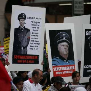 Student Protesters Hold Up Nazi Leaders' Posters