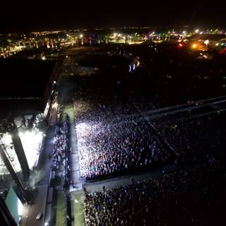 Metropolis at Night: Aerial View of a Concert Crowd