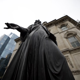 Monumental Bronze Statue Against Historic London Architecture