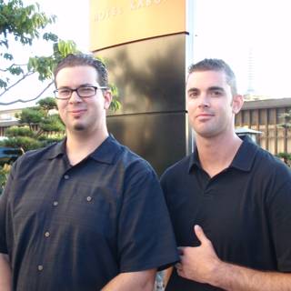 Two Men in Black Shirts