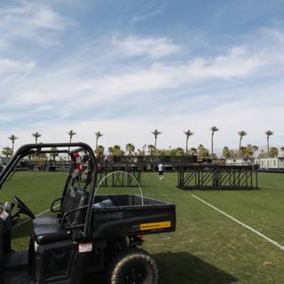 Parked Golf Cart on a Green Field