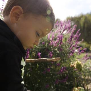 The Curiosity of Childhood among Nature's Blooms