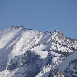Snow-Covered Mountain Peaks in Winter Sunlight