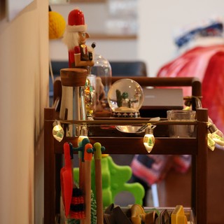Festive Holiday Display on Wooden Cart with Toys