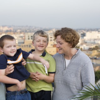 Family Portrait on Urban Rooftop Overlooking City