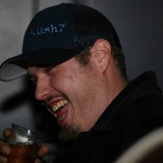 Cheers to the Funk: Travis B with a Hat and a Drink