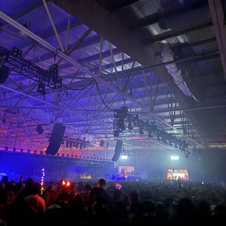 Electronic Music Festival with Dramatic Purple Stage Lighting