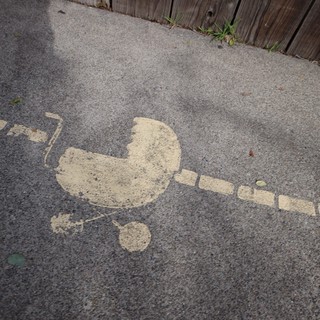 Spray Painted Stencil Art on Urban Sidewalk