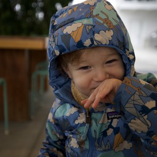 Joyful Toddler in Patagonia Winter Jacket Outdoors