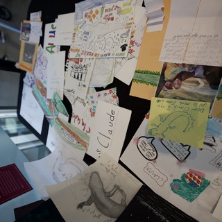 Memorial Display Board Covered with Children's Drawings and Notes