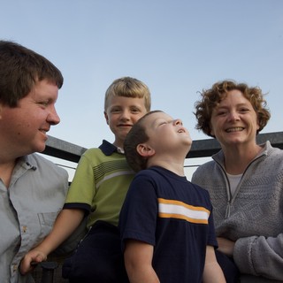Family Moment on a City Rooftop at Dusk