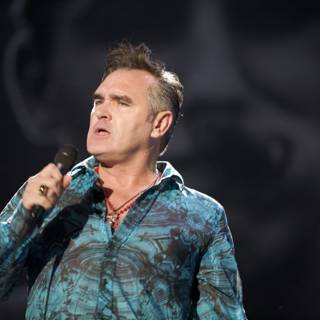 Morrissey Takes Center Stage with Microphone in Hand