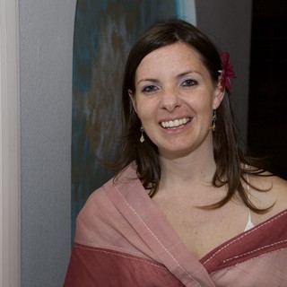 Radiant Woman in Pink Shawl at Wedding Celebration
