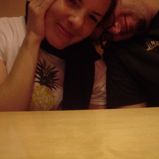 Couple Leaning Together at Table Late Night