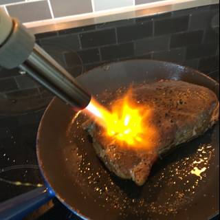 Sizzling Steak in Cooking Pan