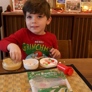 Young Boy Making Elf Breakfast on Christmas Eve