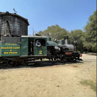 Green Locomotive Chugging Across the Felton Railroad