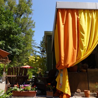 Colorful Outdoor Patio with Orange Yellow Curtains
