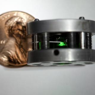 Mysterious Metal Gizmo with Glowing Green Lights
