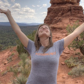 Joyful Woman Celebrating Atop Sedona Red Rock