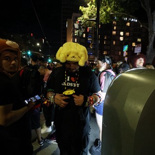 Costumed Ravers Navigate Night Festival Crowd Together