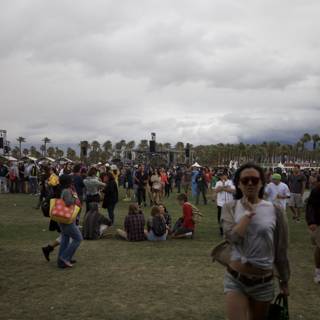 Festival-goers enjoying the grassy outdoors