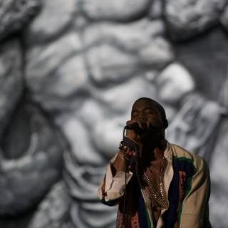 Kanye West Serenades the Crowd in Front of Art