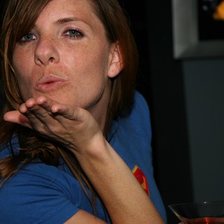 Penelope Blowing a Playful Kiss at Party