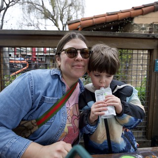 Mother and Son Enjoying Outdoor Refreshment Together