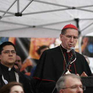 Cardinal Daniel DiNardo speaking at a religious event