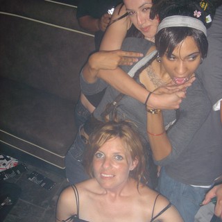 Three Women Posing at a Nightclub Party 2004