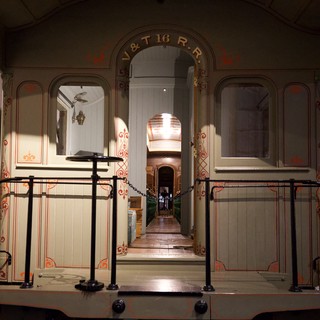 Historic Railway Car Interior with Ornate Decorative Detailing