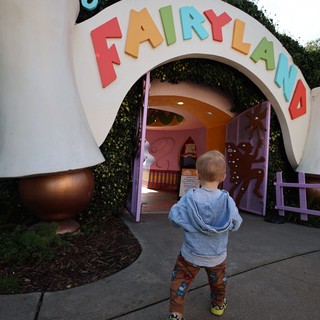 Child Entering Fairyland Play Structure at Theme Park