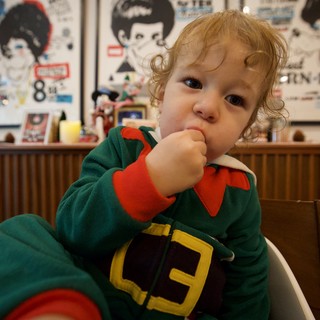 Adorable Toddler in Green Elf Costume Portrait