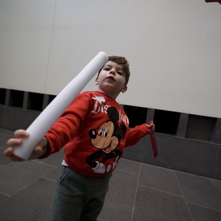 Young Boy Playing with Paper Tube at Asian Art Museum