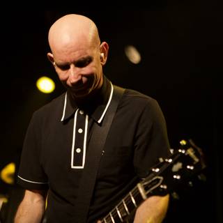 Bald Guitarist Shreds On Stage