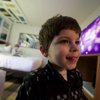 Young Boy's Joyful Evening Portrait at Home