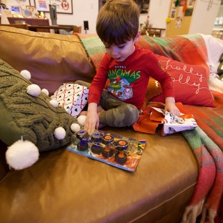 Child Opening Toy on Christmas Morning