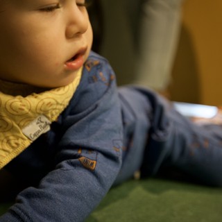 Young Child in Quiet Contemplation at Indoor Setting