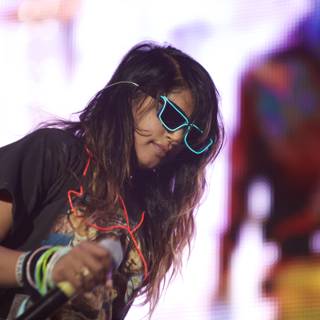 Woman Rocks the Stage in Sunglasses and Black