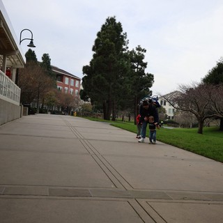 Family Walk Through Campus on Overcast Day