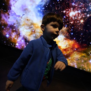 Young Explorer at Cosmic Nebula Display
