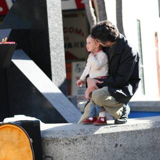 Father and Son Bonding on a Concrete Ledge
